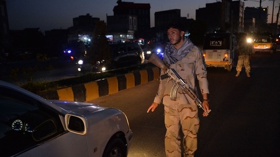 A security personnel stops a vehcile at a check point in Herat.(AFP)