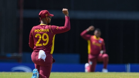 Nicholas Pooran of West Indies kneels for Black Lives Matter during the 2nd ODI between West Indies and Australia at Kensington Oval.(AFP) Nicholas Pooran of West Indies kneels for Black Lives Matter during the 2nd ODI between West Indies and Australia at Kensington Oval.(AFP)