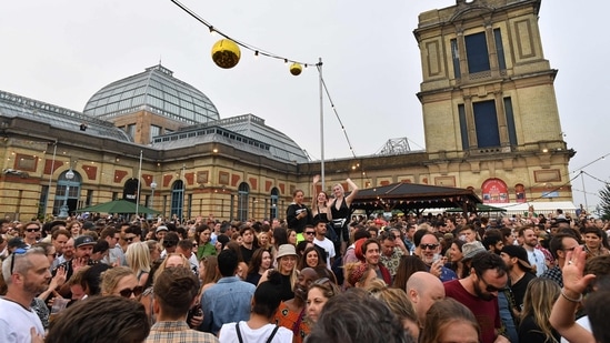 Amid the crucial Covid-19 situation in the United Kingdon, people celebrate one-day Kaleidoscope festival. (AFP) Amid the crucial Covid-19 situation in the United Kingdon, people celebrate one-day Kaleidoscope festival. (AFP)