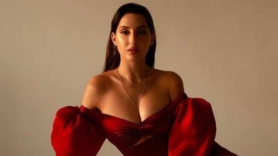 Nora Fatehi in <span class='webrupee'>?</span>51k red thigh-slit gown makes a strong case for OTT sleeves(Instagram/@norafatehi)