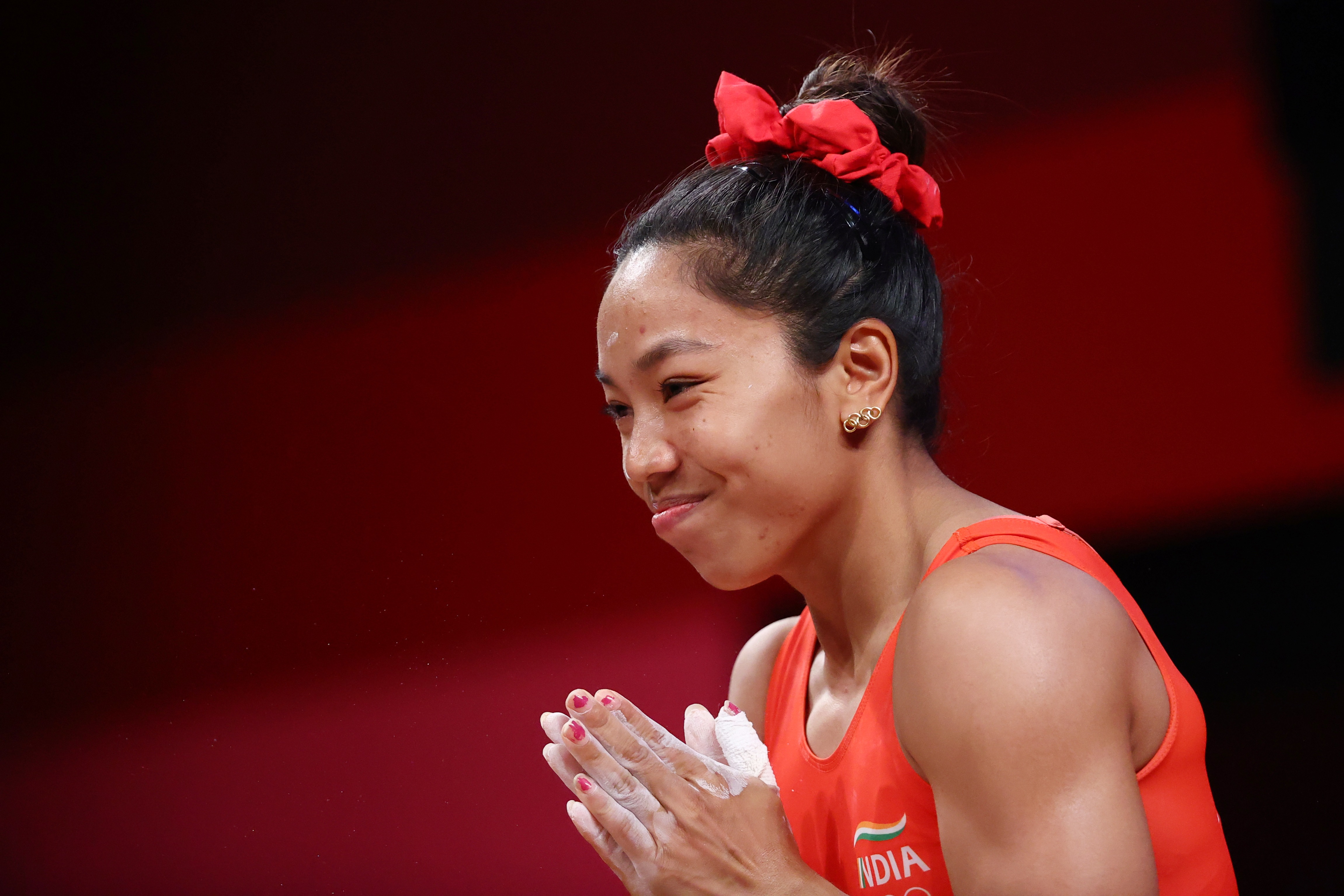 Mirabai Chanu’s Olympics ring-shaped earrings has earned appreciation from even actor Anushka Sharma. (Photo: Edgard Garrido/Reuters) Mirabai Chanu’s Olympics ring-shaped earrings has earned appreciation from even actor Anushka Sharma. (Photo: Edgard Garrido/Reuters)