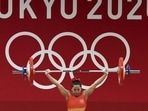 Indian weightlifter Saikhom Mirabai Chanu reacts after a successful attempt at Snatch in the women's 49kg event, in Tokyo, on July 24. Chanu wrote history for India with the first medal on the first day on Tokyo Olympics 2020. She won the silver in 49kg women’s weightlifting with a combined total of 202kg. It marked the first time that India won a medal on the opening day of an Olympics.(Gurinder Osan / PTI)