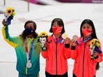 From left, silver medalist Rayssa Leal of Brazil, gold medalist Momiji Nishiya of Japan, center, and bronze medalist Funa Nakayama of Japan show their medals won in the women's street skateboarding finals at the 2020 Summer Olympics, Monday, July 26, 2021, in Tokyo, Japan. (AP Photo/Ben Curtis) From left, silver medalist Rayssa Leal of Brazil, gold medalist Momiji Nishiya of Japan, center, and bronze medalist Funa Nakayama of Japan show their medals won in the women's street skateboarding finals at the 2020 Summer Olympics, Monday, July 26, 2021, in Tokyo, Japan. (AP Photo/Ben Curtis)