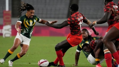 South Africa's Selvyn Davids, left, challenges Kenya's Collins Injera for the ball in their men's rugby sevens match at the 2020 Summer Olympics, Monday, July 26, 2021 in Tokyo, Japan. (AP Photo/Shuji Kajiyama) (AP) South Africa's Selvyn Davids, left, challenges Kenya's Collins Injera for the ball in their men's rugby sevens match at the 2020 Summer Olympics, Monday, July 26, 2021 in Tokyo, Japan. (AP Photo/Shuji Kajiyama) (AP)