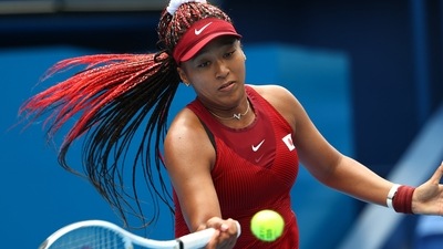 Naomi Osaka of Japan in action during her second round match against Viktorija Golubic of Switzerland at the Tokyo Olympics. (REUTERS)