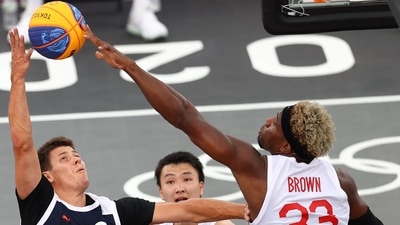 Tokyo 2020 Olympics - Basketball 3x3 - Men - Pool A - Japan v Russian Olympic Committee - Aomi Urban Sports Park, Tokyo, Japan - July 26, 2021.  Ira Brown of Japan in action with Kirill Pisklov of the Russian Olympic Committee during a match. REUTERS/Andrew Boyers (REUTERS)