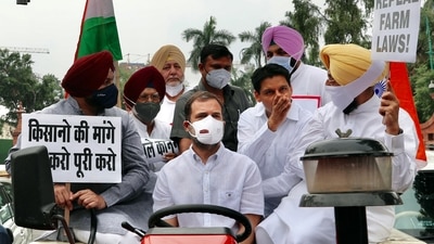 Congress leader Rahul Gandhi rides a tractor towards the Parliament marks his protest against the three farm laws, in New Delhi. (ANI Photo)