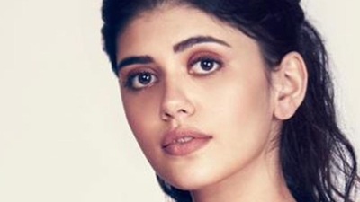 Sanjana Sanghi was seen wearing the Metallic Winged Gown with stripes of metallic polymer along with a belt by ace couturier Amit Aggarwal. (Instagram) Sanjana Sanghi was seen wearing the Metallic Winged Gown with stripes of metallic polymer along with a belt by ace couturier Amit Aggarwal. (Instagram)