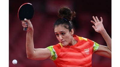 India's Manika Batra hits a shot against Britain's Tin-Tin Ho during their women's singles round 1 table tennis match at the Tokyo Metropolitan Gymnasium, in Tokyo on July 24. Batra went on to beat Ukraine's Margaryta Pesotska in Round 2 eventually crashing out of the tournament after losing to Austria’s Sofia Polcanova in Round 3 on July 26. (Jung Yeon-je / AFP) India's Manika Batra hits a shot against Britain's Tin-Tin Ho during their women's singles round 1 table tennis match at the Tokyo Metropolitan Gymnasium, in Tokyo on July 24. Batra went on to beat Ukraine's Margaryta Pesotska in Round 2 eventually crashing out of the tournament after losing to Austria’s Sofia Polcanova in Round 3 on July 26. (Jung Yeon-je / AFP)