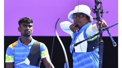 Deepika Kumari and Pravin Ramesh Jadhav of India during Archery - Mixed Team – Quarterfinals, at Yumenoshima Archery Field, in Tokyo on July 24. The Indian duo beat Chinese Taipei 5-3 in Round of 16 and lost to Korea 2-6 in Quarterfinals. (Clodagh Kilcoyne / REUTERS) Deepika Kumari and Pravin Ramesh Jadhav of India during Archery - Mixed Team – Quarterfinals, at Yumenoshima Archery Field, in Tokyo on July 24. The Indian duo beat Chinese Taipei 5-3 in Round of 16 and lost to Korea 2-6 in Quarterfinals. (Clodagh Kilcoyne / REUTERS)
