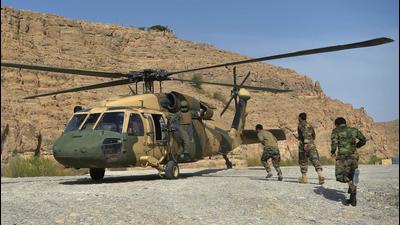 Afghan National Army soldiers unload food items and petrol oil from an Afghan Air Force Black Hawk helicopter at the hydroelectric Kajaki Dam in Kajaki, northeast of Helmand Province. (Representational image/AFP) Afghan National Army soldiers unload food items and petrol oil from an Afghan Air Force Black Hawk helicopter at the hydroelectric Kajaki Dam in Kajaki, northeast of Helmand Province. (Representational image/AFP)