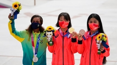 From left, silver medalist Rayssa Leal of Brazil, gold medalist Momiji Nishiya of Japan, center, and bronze medalist Funa Nakayama of Japan show their medals won in the women's street skateboarding finals at the 2020 Summer Olympics, Monday, July 26, 2021, in Tokyo, Japan. (AP Photo/Ben Curtis) (AP) From left, silver medalist Rayssa Leal of Brazil, gold medalist Momiji Nishiya of Japan, center, and bronze medalist Funa Nakayama of Japan show their medals won in the women's street skateboarding finals at the 2020 Summer Olympics, Monday, July 26, 2021, in Tokyo, Japan. (AP Photo/Ben Curtis) (AP)