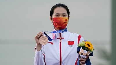 Bronze medalist Wei Meng, of China, holds celebrates after the women's skeet at the Asaka Shooting Range in the 2020 Summer Olympics, Monday, July 26, 2021, in Tokyo, Japan. (AP Photo/Alex Brandon) (AP) Bronze medalist Wei Meng, of China, holds celebrates after the women's skeet at the Asaka Shooting Range in the 2020 Summer Olympics, Monday, July 26, 2021, in Tokyo, Japan. (AP Photo/Alex Brandon) (AP)