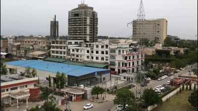 The area around the ​dumping ground in Industrial Area, Phase 8B, Mohali, is not only surrounded by industries but also has some residential areas. (HT FILE PHOTO)