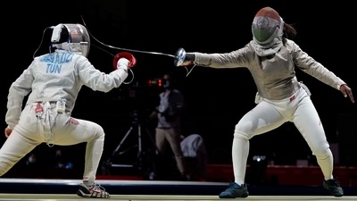 Tokyo: Nadia Ben Azizi of Tunisia, left, Chadalavada Anandha Sundh Bhavani of india compete in the women's individual round of 64 Sabre competition at the 2020 Summer Olympics, Monday, July 26, 2021, in Chiba, Japan.AP/PTI Photo(AP07_26_2021_000004A) (AP) Tokyo: Nadia Ben Azizi of Tunisia, left, Chadalavada Anandha Sundh Bhavani of india compete in the women's individual round of 64 Sabre competition at the 2020 Summer Olympics, Monday, July 26, 2021, in Chiba, Japan.AP/PTI Photo(AP07_26_2021_000004A) (AP)