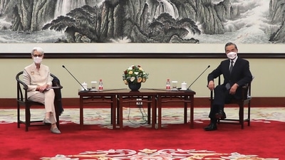US Deputy Secretary of State Wendy Sherman and Chinese Foreign Minister Wang Yi sit together in Tianjin, China on Monday. (AP Photo) US Deputy Secretary of State Wendy Sherman and Chinese Foreign Minister Wang Yi sit together in Tianjin, China on Monday. (AP Photo)