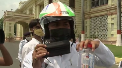 The MLAs were wearing helmets and carrying first aid boxes. (ANI Twitter) The MLAs were wearing helmets and carrying first aid boxes. (ANI Twitter)