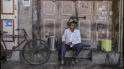 A man sits outside a closed store in Mumbai. (Representational image/Bloomberg) A man sits outside a closed store in Mumbai. (Representational image/Bloomberg)