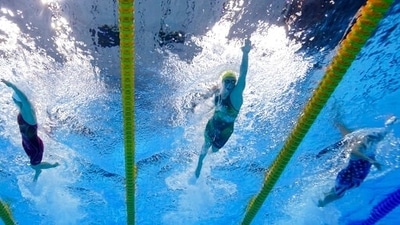 Australia's Ariarne Titmus, center, swims in a 200-meter freestyle heat at the 2020 Summer Olympics, Monday, July 26, 2021, in Tokyo. (AP Photo/David J. Phillip) (AP) Australia's Ariarne Titmus, center, swims in a 200-meter freestyle heat at the 2020 Summer Olympics, Monday, July 26, 2021, in Tokyo. (AP Photo/David J. Phillip) (AP)