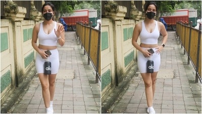 Neha teamed her look with a black face mask, white sneakers, white socks, a loose ponytail and glowing skin. What do you think of Neha and Malaika's looks? (Varinder Chawla) Neha teamed her look with a black face mask, white sneakers, white socks, a loose ponytail and glowing skin. What do you think of Neha and Malaika's looks? (Varinder Chawla)