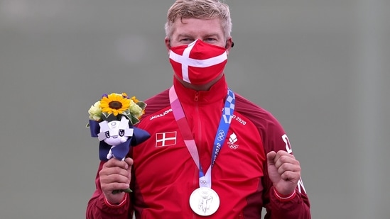 Tokyo 2020 Olympics - Shooting - Men's Skeet - Medal Ceremony - Asaka Shooting Range, Tokyo, Japan - July 26, 2021. Silver medalist Jesper Hansen of Denmark celebrates REUTERS/Ann Wang(REUTERS)