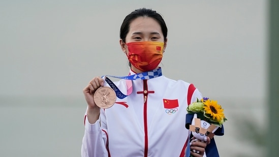 Bronze medalist Wei Meng, of China, holds celebrates after the women's skeet at the Asaka Shooting Range in the 2020 Summer Olympics, Monday, July 26, 2021, in Tokyo, Japan. (AP Photo/Alex Brandon)(AP)