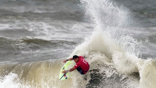 France's Michel Bourez maneuvers on a wave during the third round of the men's surfing competition at the 2020 Summer Olympics, Monday, July 26, 2021, at Tsurigasaki beach in Ichinomiya, Japan. (AP Photo/Francisco Seco)(AP)