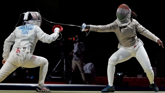 Nadia Ben Azizi of Tunisia in action against Chadalavada Anandha Sundh Bhavani of India during the women's individual Round of 64 Sabre competition, in Chiba on July 26. Devi eventually lost to France’s Manon Brunet in the Round of 32.(AP / PTI )