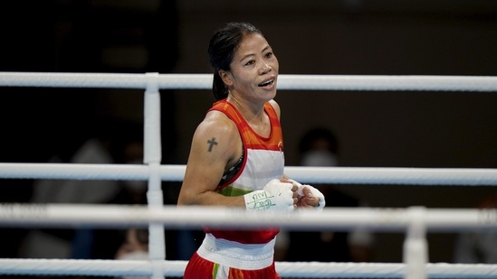 Indian boxer Mary Kom celebrates after her bout with Miguelina Hernandez Garcia of the Dominican Republic, during their women's flyweight 51-kg boxing match, in Tokyo, on July 25. The final scoreline was 4-1.(PTI)
