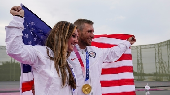 Amber English, left, and Vincent Hancock, both of the United States, celebrate taking the gold medal in the women's and men's skeet at the Asaka Shooting Range in the 2020 Summer Olympics, Monday, July 26, 2021, in Tokyo, Japan. (AP Photo/Alex Brandon)(AP)