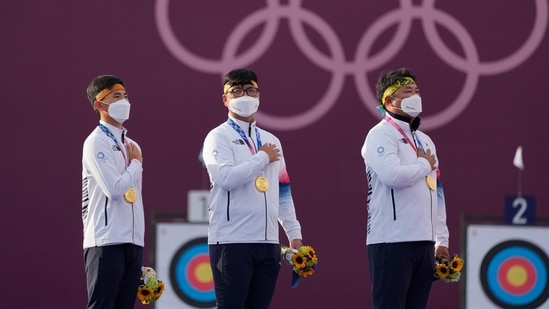 From left; Gold medal winners South Korea's Kim Je Deok, Kim Woojin, and Oh Jinhyek(AP)