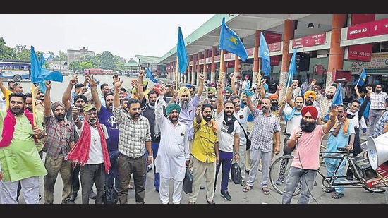 Punbus Contractual Employees’ Union protesting at ISBT in Ludhiana on Monday. (Gurpreet Singh/HT)