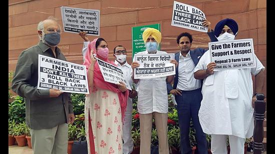 Shiromani Akali Dal president Sukhbir Singh Badal and other MPs protesting outside Parliament on Monday.