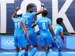 Rupinder Pal Singh of India celebrates with teammates after scoring against Spain in a Pool A match at the Tokyo Olympics