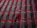  A man sits among rows of empty seats at the Tokyo Metropolitan Gymnasium 