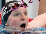 Lydia Jacoby, of the United States, reacts after winning the final of the women's 100-meter breaststroke at the 2020 Summer Olympics. 