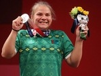 Bronze medalist Polina Guryeva of Turkmenistan poses with her medal. 