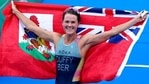 Gold medalist Flora Duffy of Bermuda celebrates after winning the women's individual triathlon competition at the 2020 Summer Olympics. (AP) Gold medalist Flora Duffy of Bermuda celebrates after winning the women's individual triathlon competition at the 2020 Summer Olympics. (AP)