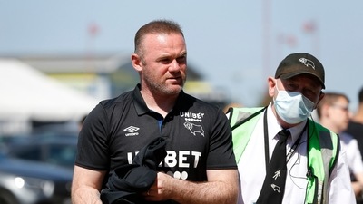 Derby County manager Wayne Rooney (in black) injures his own player with a tackle in training, midfielder out for 3 months. (Reuters)