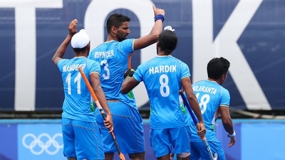 Rupinder Pal Singh of India celebrates with teammates after scoring against Spain in a Pool A match at the Tokyo Olympics (REUTERS)