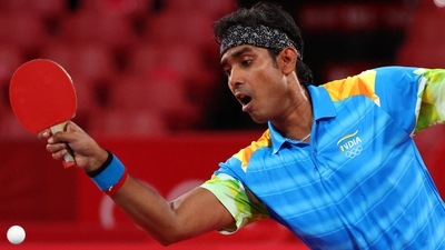 Sharath Kamal Achanta of India in action against Ma Long of China in round 3 of men's singles table tennis in Tokyo Olympics (REUTERS)