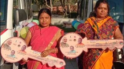 Two members of women SHGs with dummy keys to the four-wheelers they bought on Aajeevika mission loan. (Sourced) Two members of women SHGs with dummy keys to the four-wheelers they bought on Aajeevika mission loan. (Sourced)