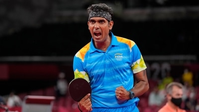 India's Achanta Kamal reacts during the table tennis men's singles third round match against China's Ma Long at the 2020 Summer Olympics, Tuesday, July 27, 2021, in Tokyo. (AP Photo/Kin Cheung) (AP) India's Achanta Kamal reacts during the table tennis men's singles third round match against China's Ma Long at the 2020 Summer Olympics, Tuesday, July 27, 2021, in Tokyo. (AP Photo/Kin Cheung) (AP)