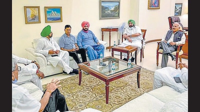 Chief minister Capt Amarinder Singh with Punjab Congress chief Navjot Singh Sidhu and other leaders in Chandigarh on Tuesday. (HT Photo) Chief minister Capt Amarinder Singh with Punjab Congress chief Navjot Singh Sidhu and other leaders in Chandigarh on Tuesday. (HT Photo)