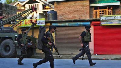 Jammu and Kashmir, July 23 (ANI): Security personnel in action after an encounter between security forces and militants at the Warpora area of Sopore, in Baramulla on Friday. (ANI Photo) (ANI)