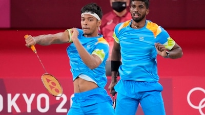 Tokyo: India's Satwiksairaj Rankireddy and Chirag Shetty play against Britain's Ben Lane and Sean Vendy during their men's doubles group play stage badminton match at the 2020 Summer Olympics, Tuesday, July 27, 2021, in Tokyo, Japan.AP/PTI Photo(AP07_27_2021_000038A) (AP) Tokyo: India's Satwiksairaj Rankireddy and Chirag Shetty play against Britain's Ben Lane and Sean Vendy during their men's doubles group play stage badminton match at the 2020 Summer Olympics, Tuesday, July 27, 2021, in Tokyo, Japan.AP/PTI Photo(AP07_27_2021_000038A) (AP)