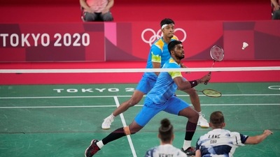 Tokyo: India's Satwiksairaj Rankireddy and Chirag Shetty play against Britain's Ben Lane and Sean Vendy during their men's doubles group play stage badminton match at the 2020 Summer Olympics, Tuesday, July 27, 2021, in Tokyo, Japan.AP/PTI Photo(AP07_27_2021_000041B) (AP) Tokyo: India's Satwiksairaj Rankireddy and Chirag Shetty play against Britain's Ben Lane and Sean Vendy during their men's doubles group play stage badminton match at the 2020 Summer Olympics, Tuesday, July 27, 2021, in Tokyo, Japan.AP/PTI Photo(AP07_27_2021_000041B) (AP)