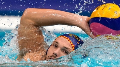 Spain's Martin Famera moves the ball during a preliminary round men's water polo match against Montenegro at the 2020 Summer Olympics, Tuesday, July 27, 2021, in Tokyo, Japan. (AP Photo/Mark Humphrey) (AP) Spain's Martin Famera moves the ball during a preliminary round men's water polo match against Montenegro at the 2020 Summer Olympics, Tuesday, July 27, 2021, in Tokyo, Japan. (AP Photo/Mark Humphrey) (AP)