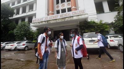 (From L) Mahendra Bhoye, Komal Marade and Rohini Bhokate, students of BJ Medical college at the college campus, on Monday. The medical students from tribal communities, who are studying in BJ Medical college and other colleges, are hostel facing hostel accommodation issues. (Pratham Gokhale/HT)