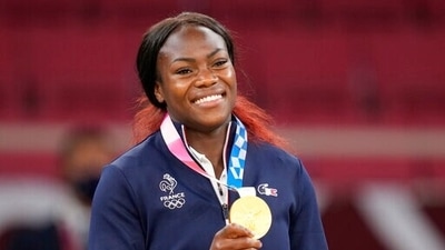 Gold medalist Clarisse Agbegnenou of France celebrates with her gold medal for the women -63kg judo match at the 2020 Summer Olympics in Tokyo, Japan, Tuesday, July 27, 2021. (AP Photo/Vincent Thian) (AP) Gold medalist Clarisse Agbegnenou of France celebrates with her gold medal for the women -63kg judo match at the 2020 Summer Olympics in Tokyo, Japan, Tuesday, July 27, 2021. (AP Photo/Vincent Thian) (AP)